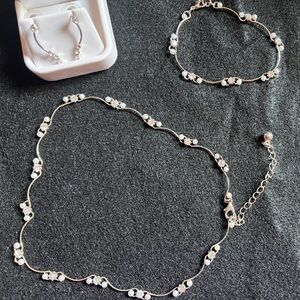 Necklace, Bracelet and earring set. Sterling silver with clear stones.